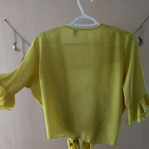 Yellow tie-front shirt with ruffle sleeves